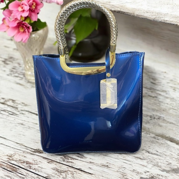 Handbags - Stunning Blue Boutique Crossbody Bag strap is inside the bag brand new!! NWT!